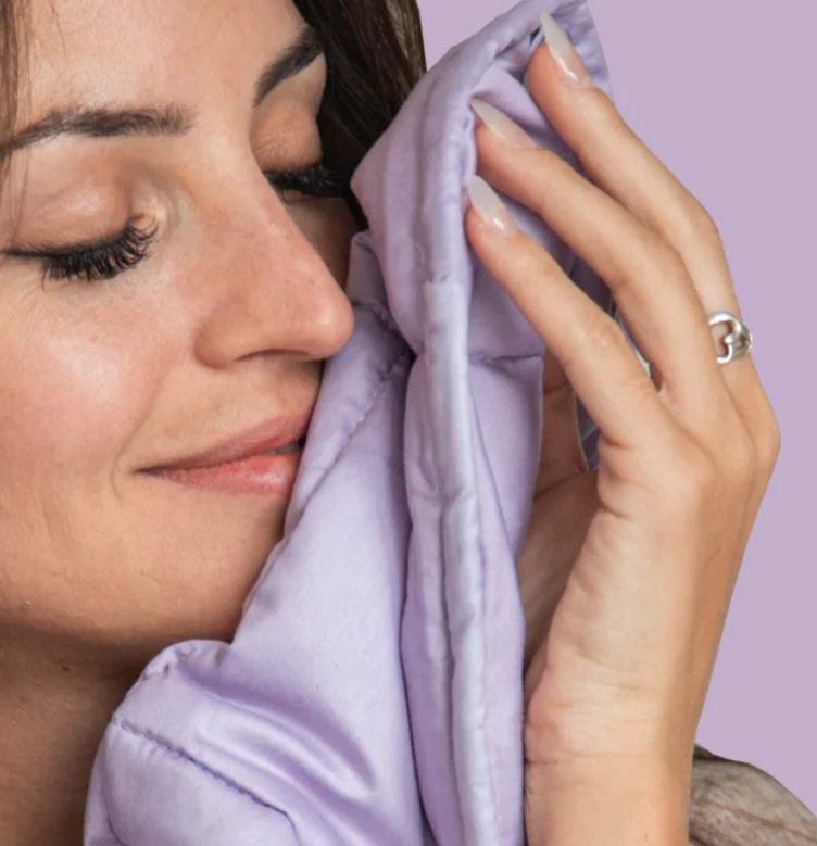 Woman using a blanket from Essential Blankets brand
